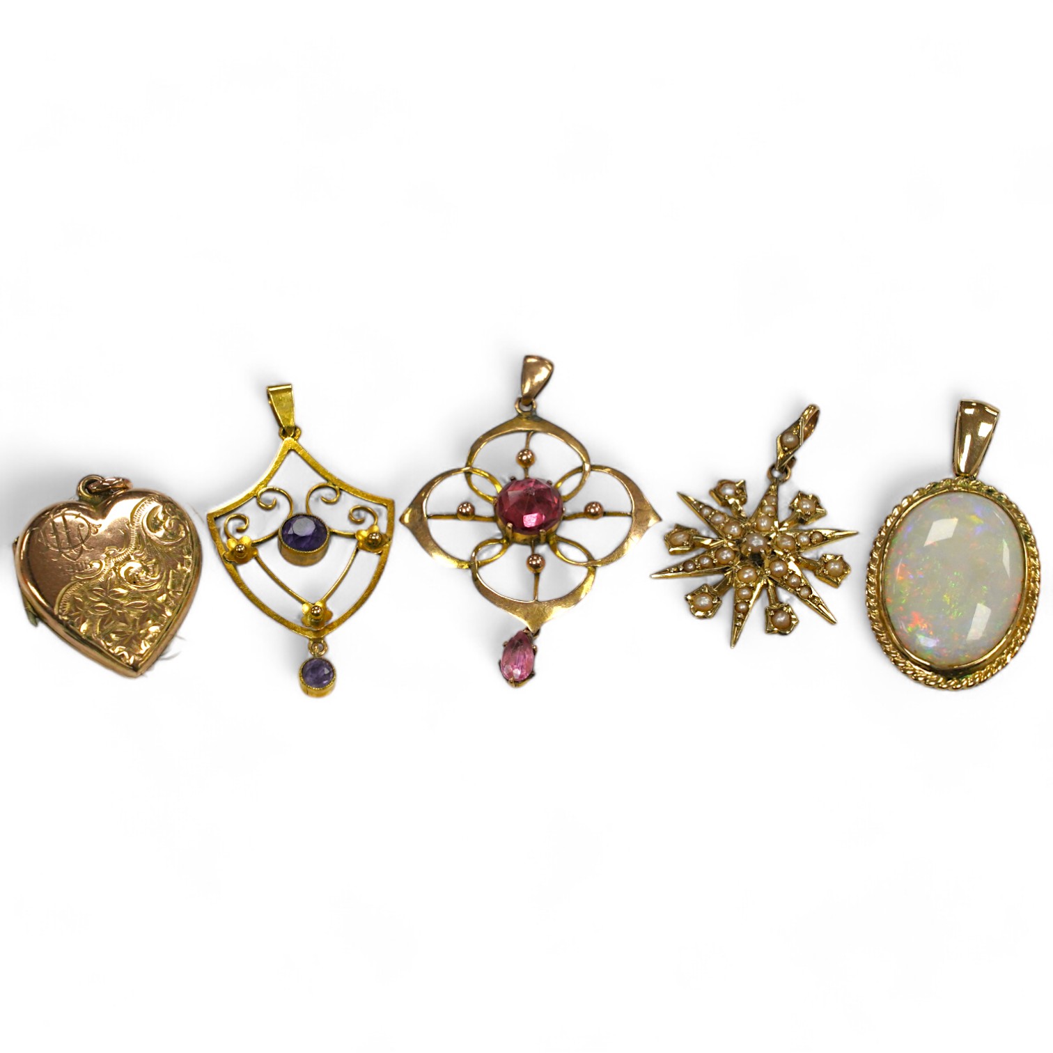 Five assorted gem set pendants including a 9ct and seed pearl star, 20mm, a yellow metal and amethyst set drop, a yellow metal and white opal and an Edwardian yellow metal heart shaped locket. Condition - fair